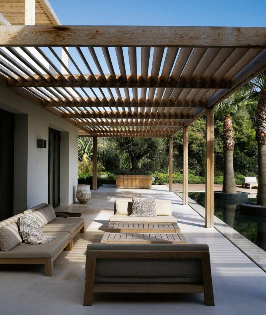 Backyard Long Paio With Wooden Furniture And Sunspot At The