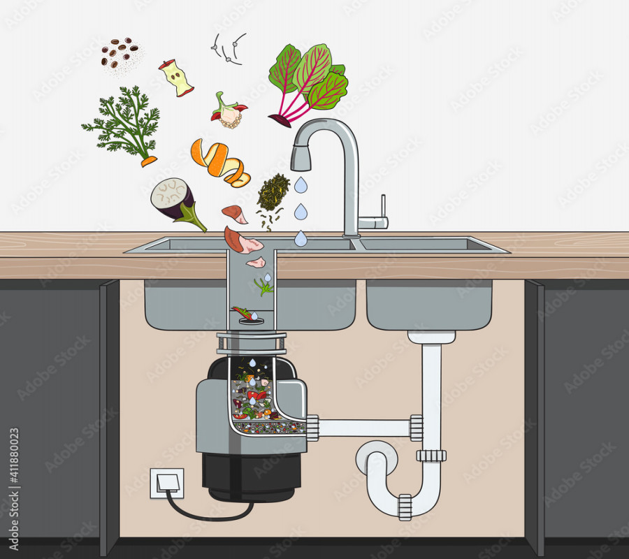 Food waste disposer installed under kitchen sink with scraps