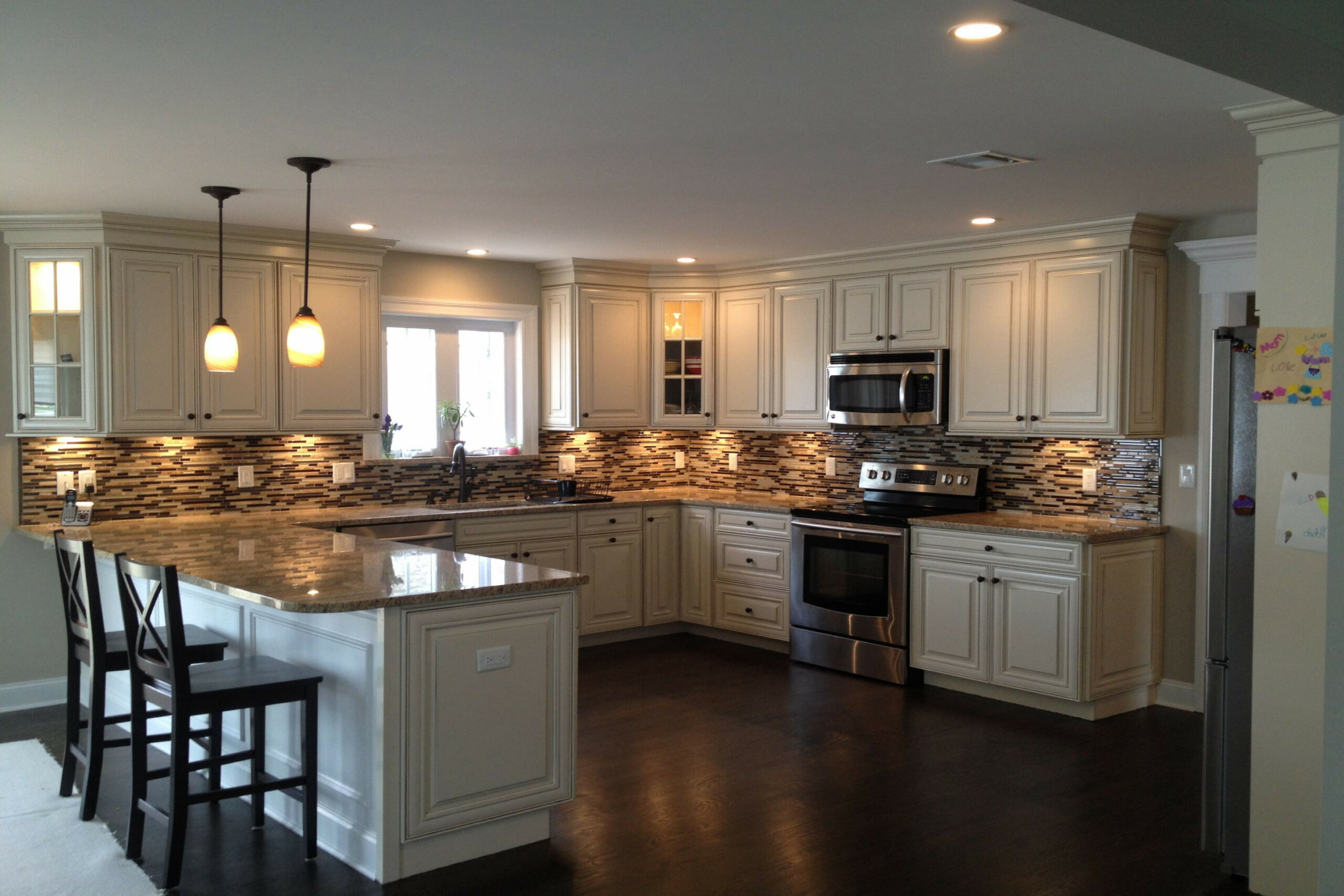 U shaped kitchen with peninsula design with American Woodmark