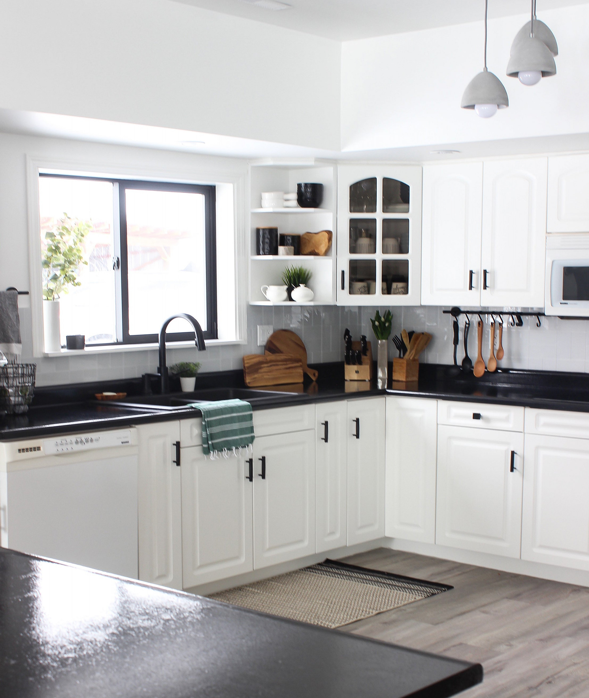 White Kitchen Cabinets with Black Countertops Are the Next Big
